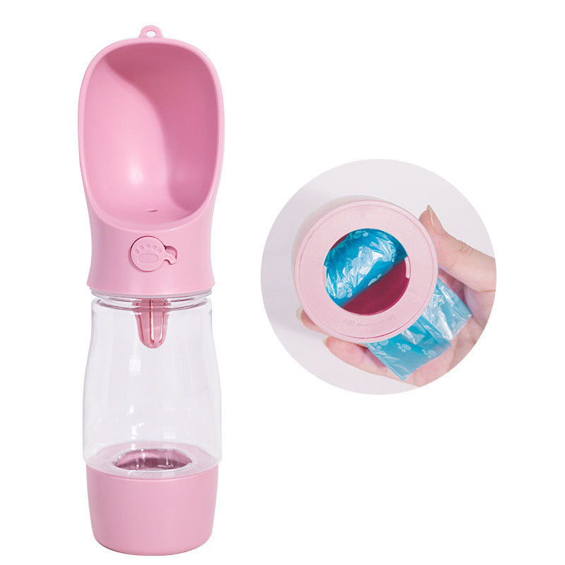 Bol d'eau portable pour chien en rose, pratique pour les sorties, avec compartiment pour sacs à déchets.