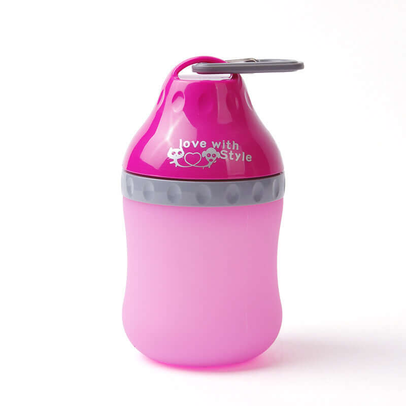 Bouteille pliable en silicone rose pour animaux, idéale pour transport, alimentation et eau, design mignon.