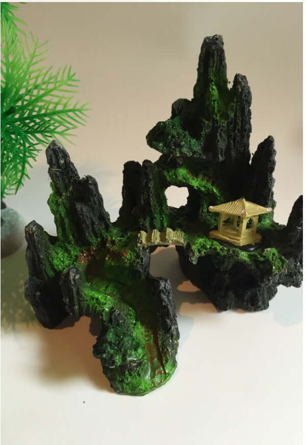 Ultra realistic synthetic rock decor for aquariums, featuring a gazebo and lush green details.