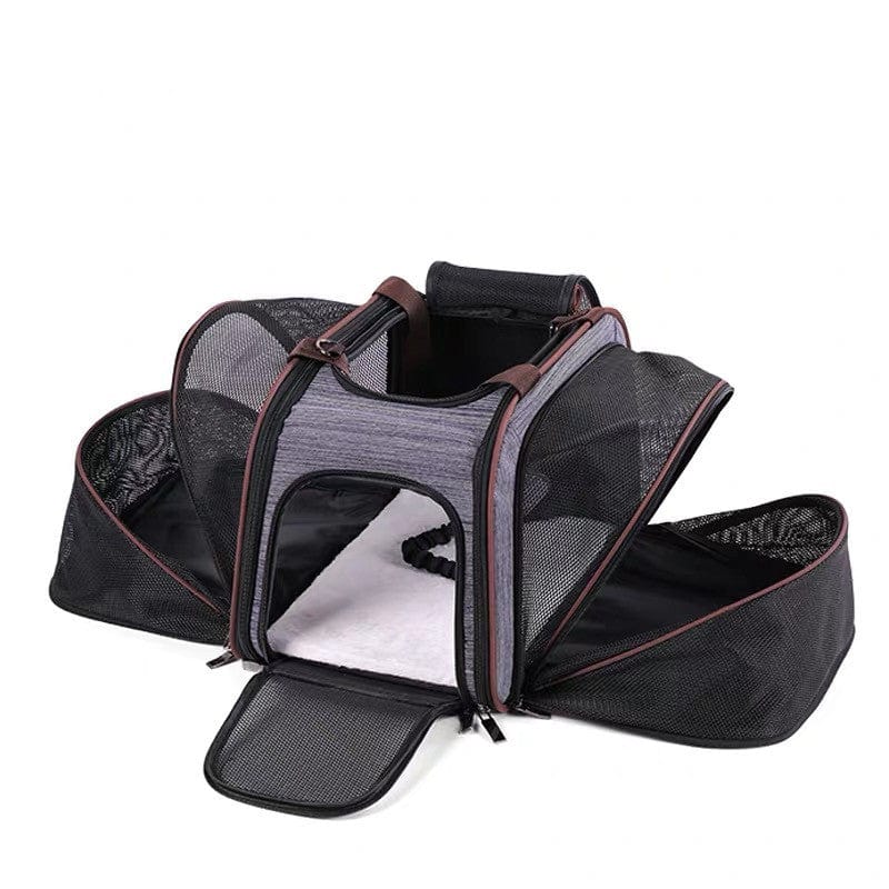 Sac à dos pour chien portable en denim ouvert, caractérisé par des mesh et des poches pratiques.