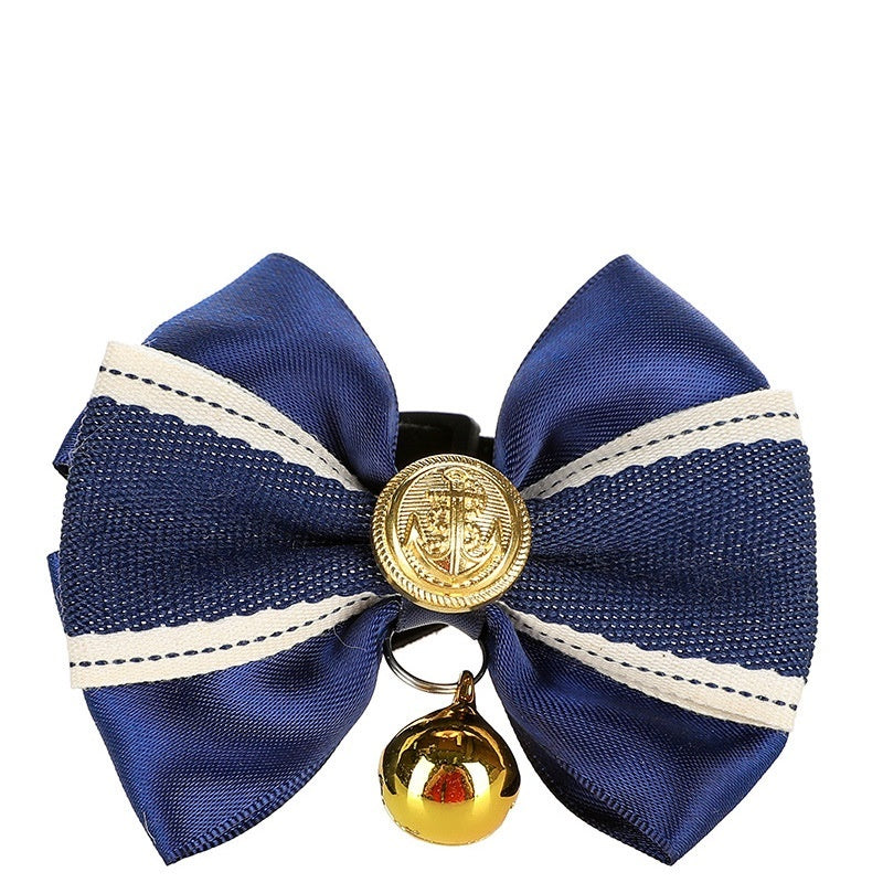 Navy blue fabric bow with gold bell for pet accessories, stylish and durable, perfect for pets.