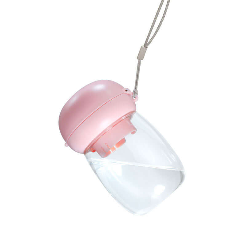Gobelet pliable et portable rose pour animaux de compagnie, idéal pour hydrater chiens et chats en déplacement.