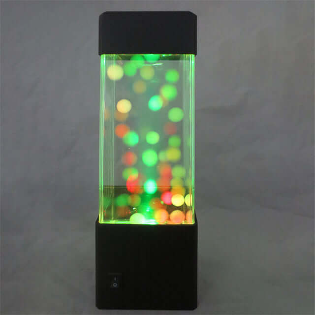 Veilleuse Jellyfish LED colorée créant un effet relaxant avec lumières flottantes et design moderne.