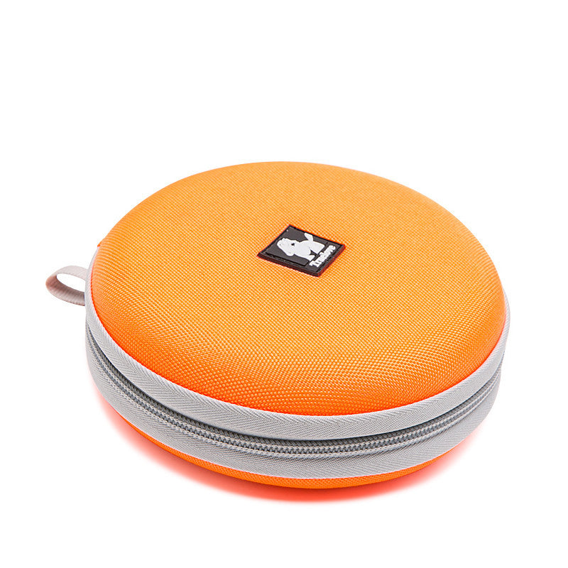 Bol pliable orange pour chiens, idéal pour voyager avec des animaux, léger et pratique.