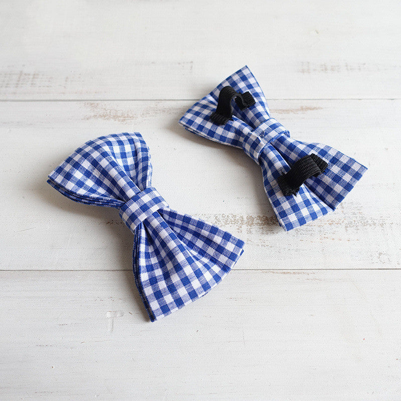 Noeuds papillon en polyester bleu à carreaux pour chiens, accessoires élégants et durables.