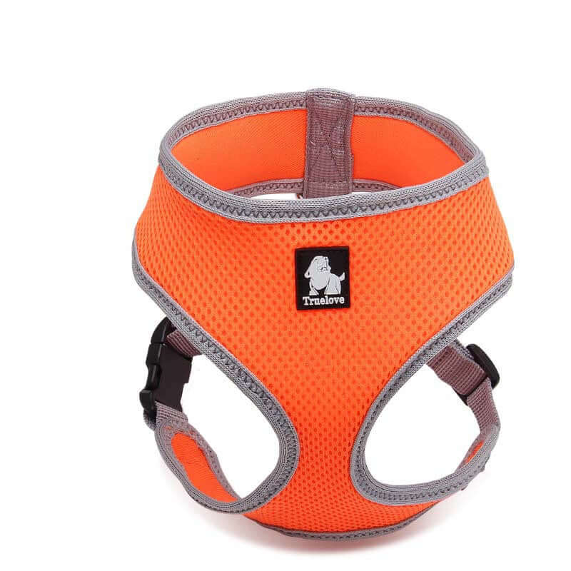 Harnais respirant orange pour chien, conçu pour le confort et la sécurité lors des promenades.