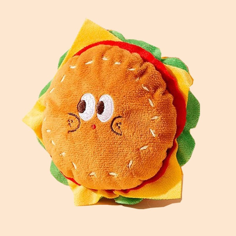 Jouet en forme de hamburger pour chien, doux et coloré, parfait pour le jeu interactif.