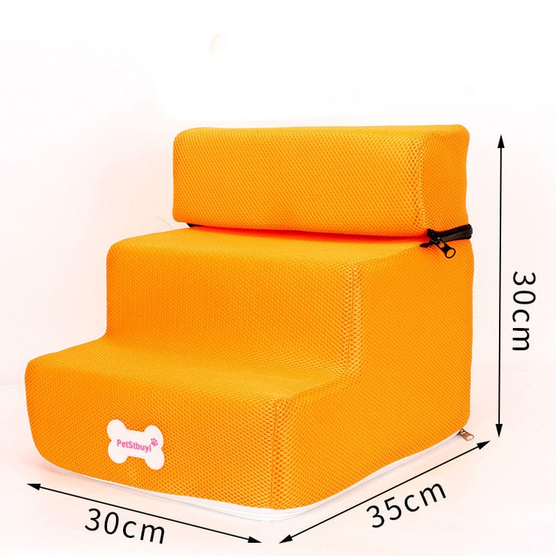 Escaliers pour chiens en orange, conçu en mousse confortable, idéal pour accéder au canapé ou au lit.