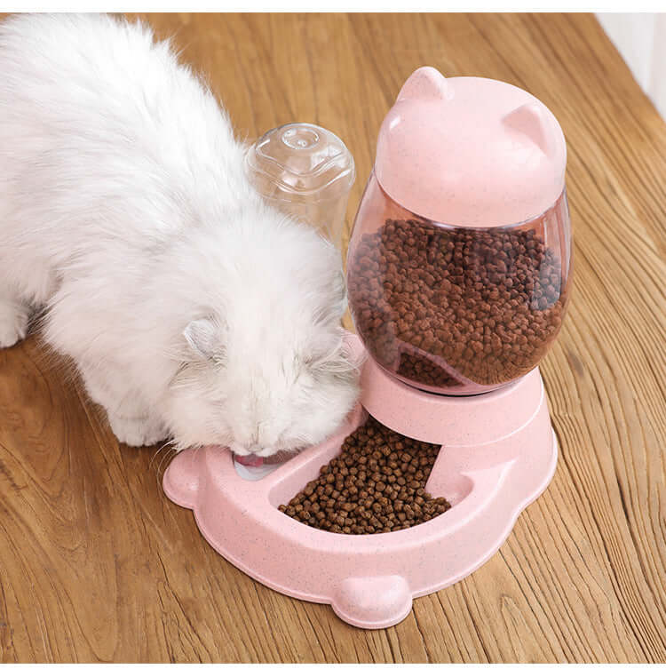 Distributeur automatique de nourriture rose pour chats avec réservoir et croquettes