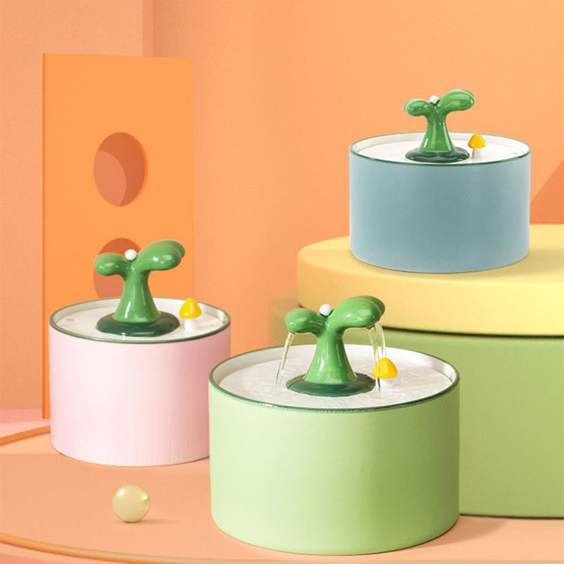 Fontaine à boire automatique en céramique pour chats, design coloré et moderne, offrant eau fraîche en continu.