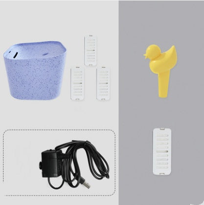 Distributeur d'eau automatique pour chats avec accessoires, incluant câbles et dispositifs de filtration.