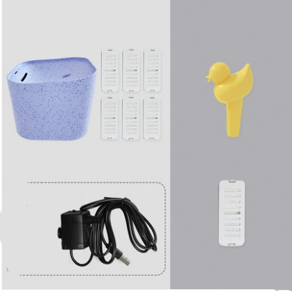 Distributeur d'eau automatique pour chats avec accessoires, y compris pompes et filtres pour mouvement d'eau.