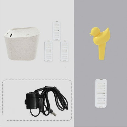 Distributeur d'eau automatique pour chats avec accessoires en plastique, incluant un chargeur et des pièces de rechange.