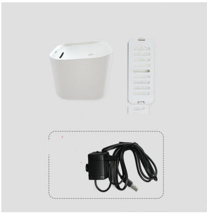 Distributeur d'eau automatique pour chats avec filtres et alimentation électrique.