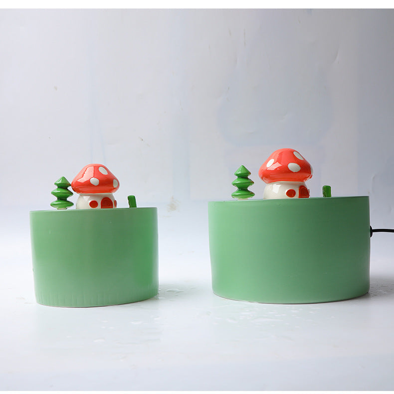 Fontaine à eau électrique en céramique pour animaux avec champignons décoratifs, offrant une esthétique charmante.