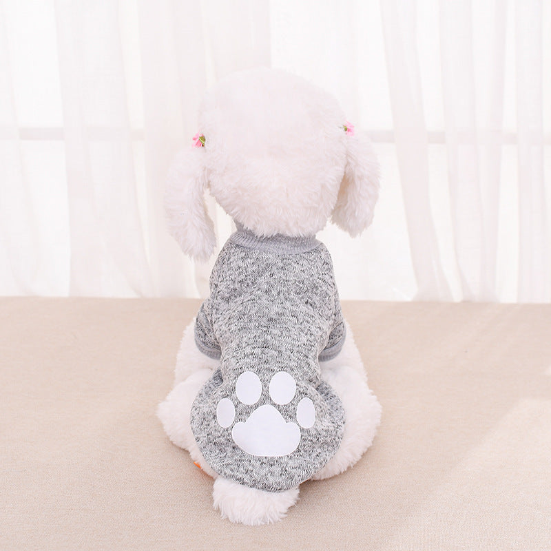 Pull pour chien en laine grise avec motif patte sur le dos, parfait pour un look décontracté et confortable.