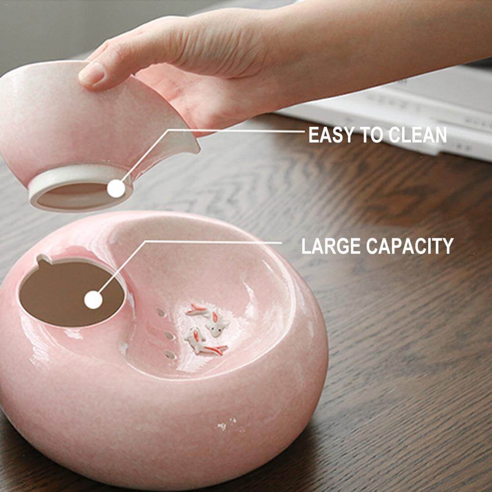 Distributeur d'eau automatique pour chat en porcelaine rose, facile à nettoyer et grande capacité.