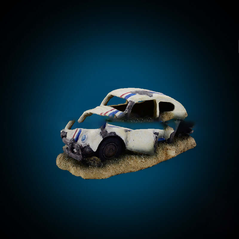 Miniature decorative old car ornament for aquarium, featuring weathered paint and rustic details.