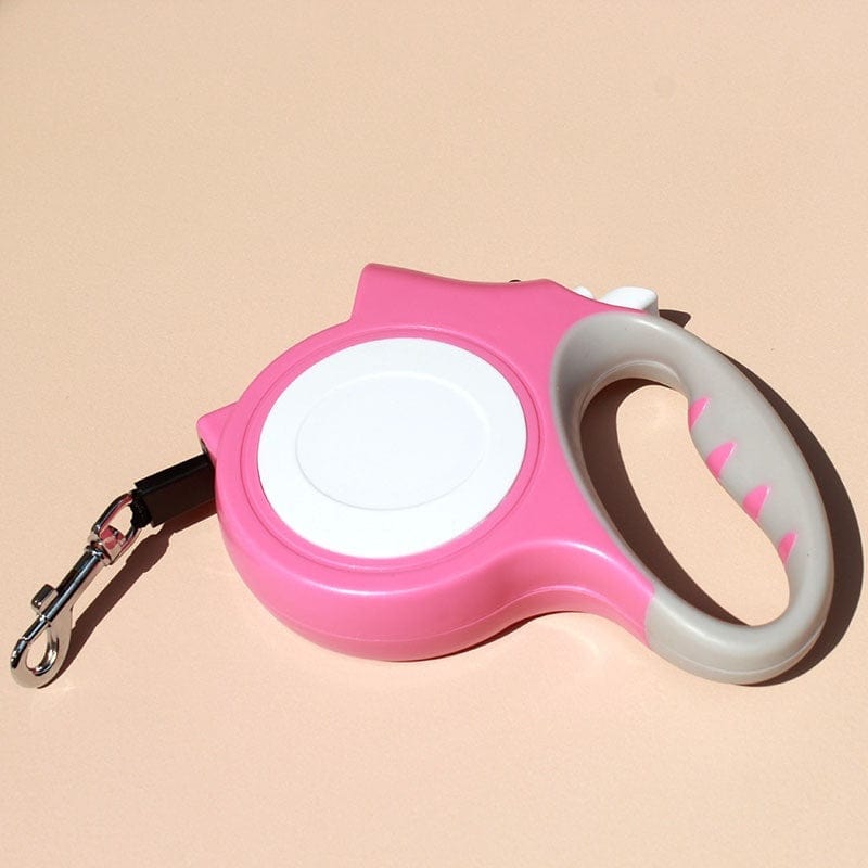 Ceinture automatique rétractable rose pour chats et chiens, idéale pour les promenades et le contrôle.