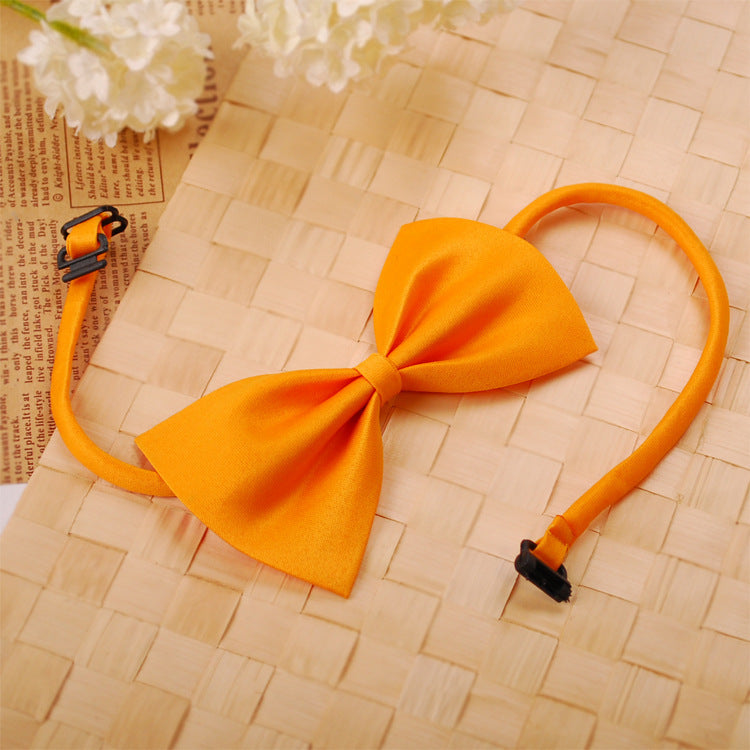 Collier pour animaux avec nœud orange, accessoire élégant pour chien ou chat.