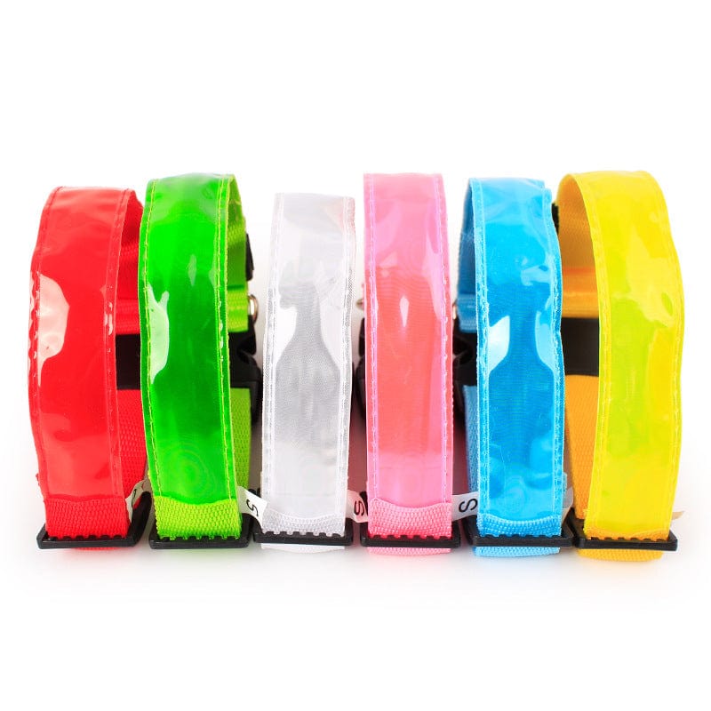 Colorful nylon dog collars in red, green, pink, blue, and yellow with adjustable lengths for pets.