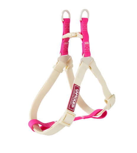 Harnais de sécurité pour chien en PVC rose et beige, taille ajustable pour confort maximal.