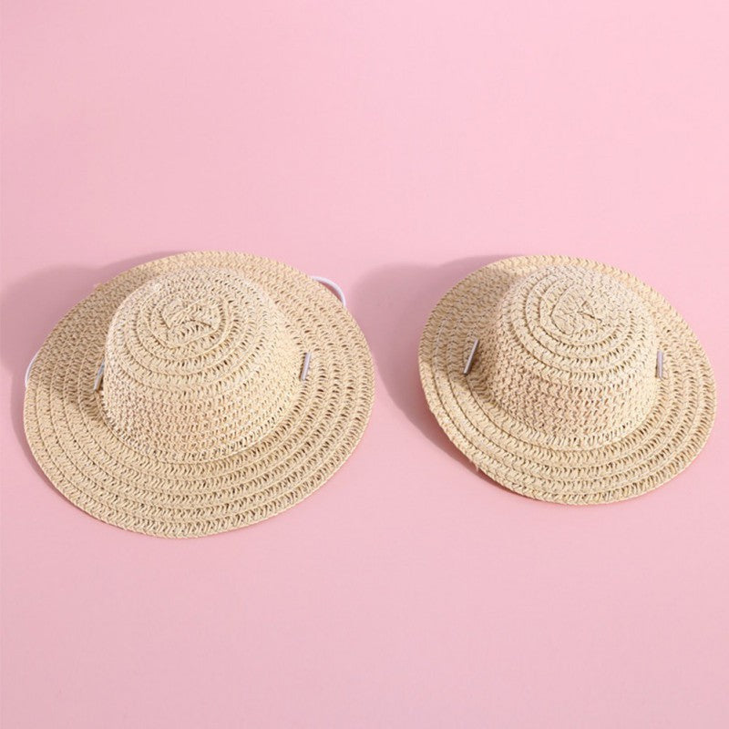 Chapeaux en papier ajustables pour animaux de compagnie, disponibles en deux tailles, sur fond rose.
