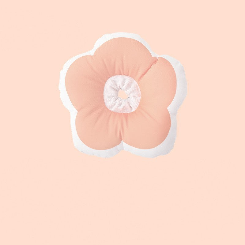 Coussin pour animaux en forme de fleur, coloris rose et blanc, parfait pour le confort de vos compagnons.