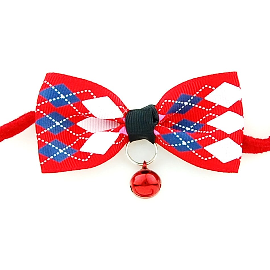 Nœud papillon rouge et blanc avec cloche pour chiens et chats, accessoire élégant et durable.