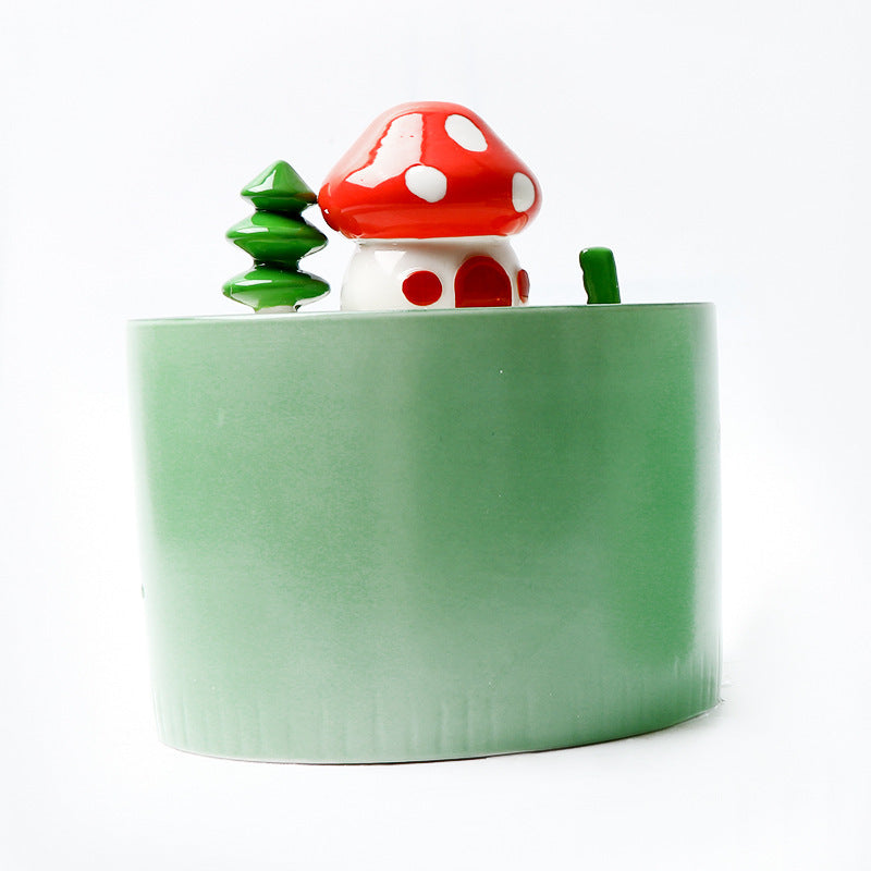 Fontaine à eau électrique en céramique pour animaux avec décor champignon rouge et arbre vert.