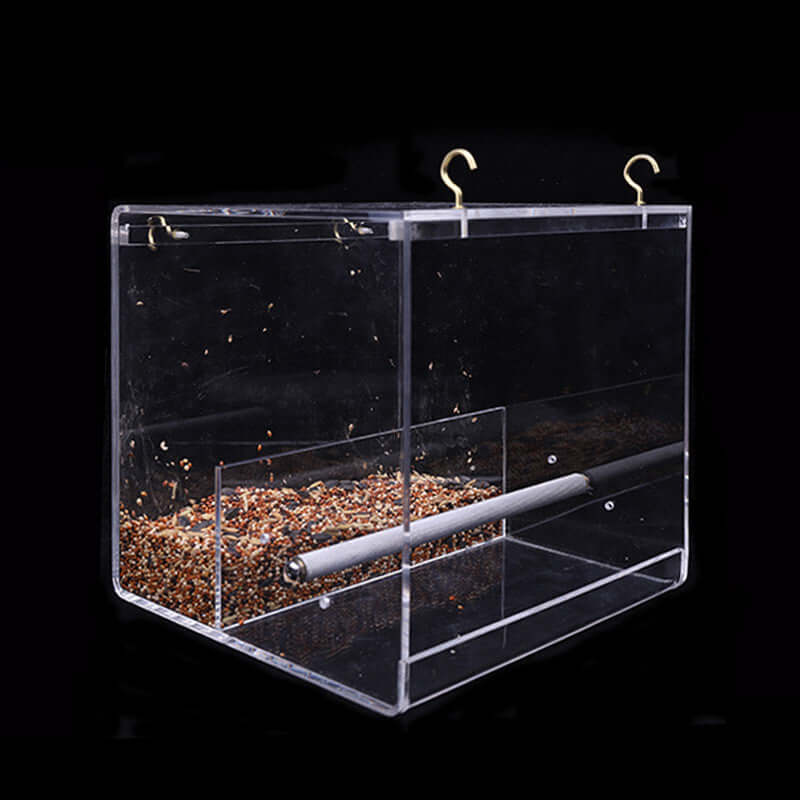 Nourriture acrylique pour oiseaux en mangeoire transparente, matériau sûr et durable pour un environnement sain.