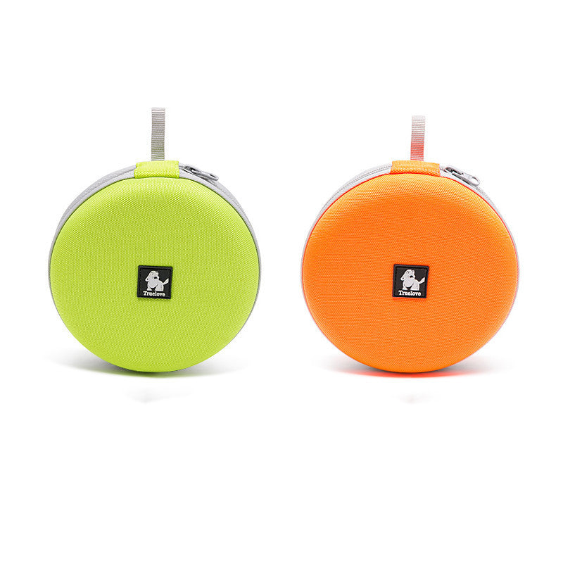Zoomed view of round green and orange storage pouches, ideal for pet accessories and travel items.