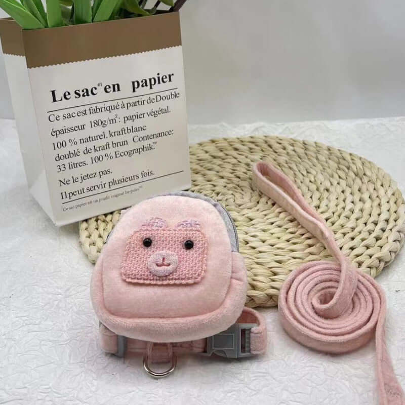 Sac à dos pour animaux en rose avec harnais et laisse, idéal pour le confort et la sécurité de votre chat ou chien.