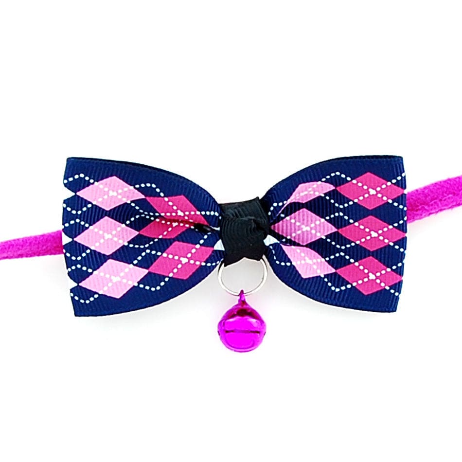 Nœud papillon en polyester pour chiens et chats avec cloche en cuivre, design coloré en rose et bleu.