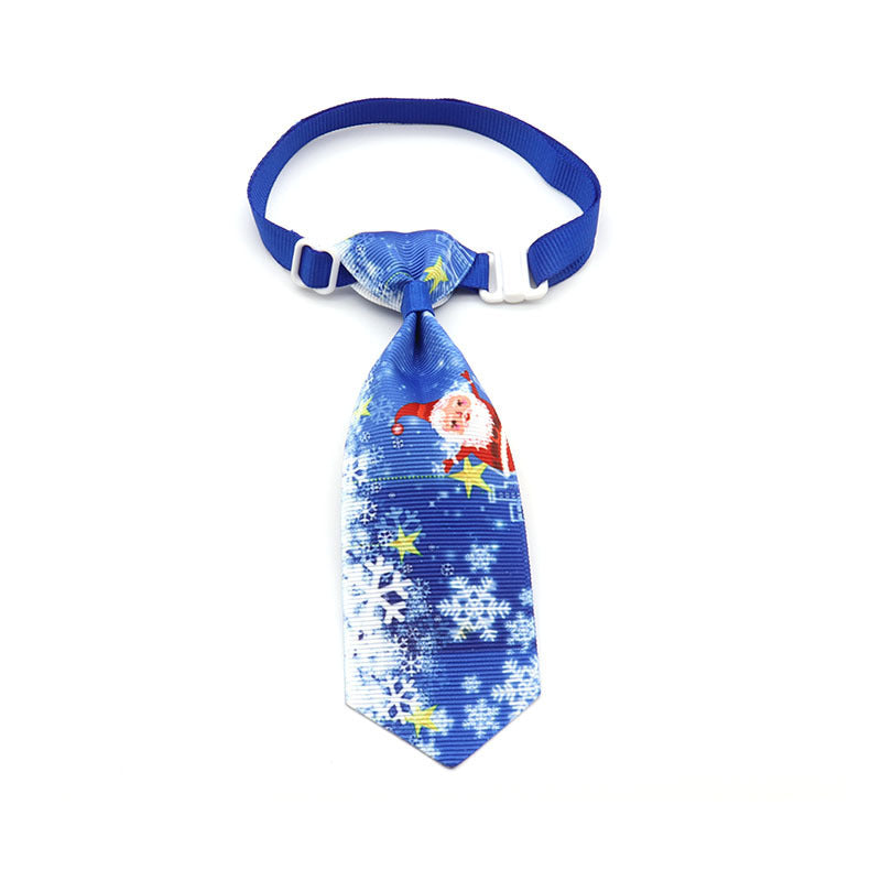 Nœud papillon de Noël pour animaux de compagnie, motif festif avec père Noël et flocons de neige sur fond bleu.