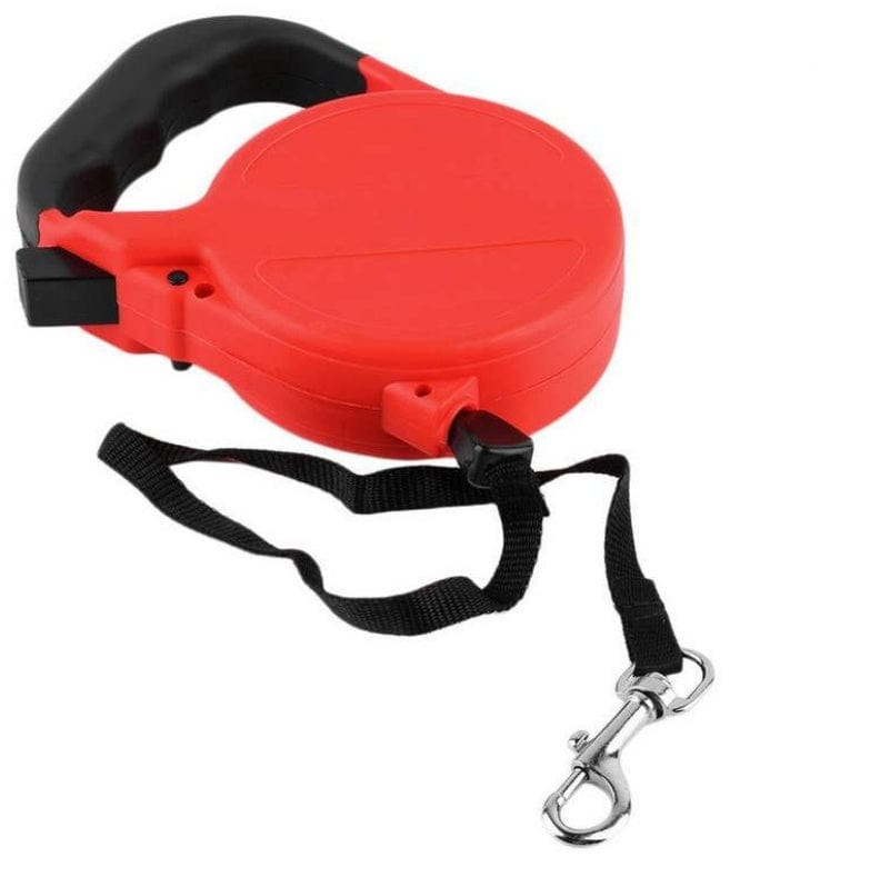 Laisse rétractable automatique rouge pour chiens et chats, idéale pour promenades en plein air.