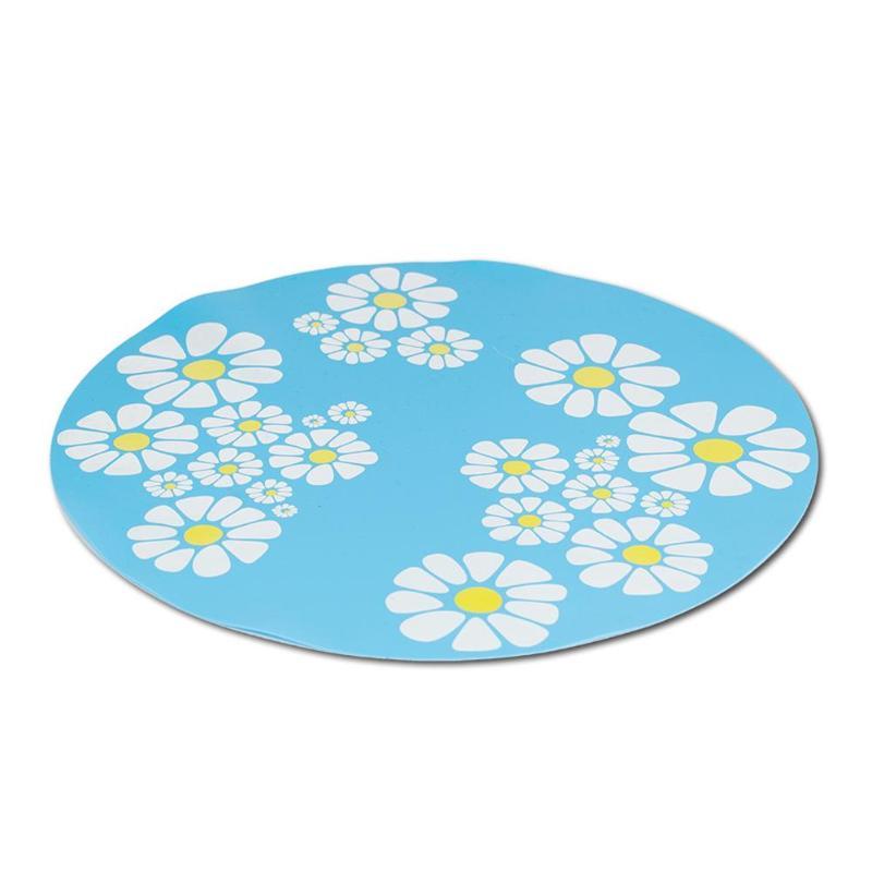 Tapis rond bleu décoré de fleurs blanches, idéal pour ajout de style et confort dans n'importe quelle pièce.
