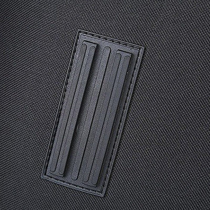 Detail of durable polyester fabric with textured patch for portable pet capsule.