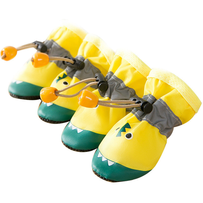 Chaussures douces en tissu pour chiens, style amusant avec design de dinosaure, parfaites pour le confort des pattes.