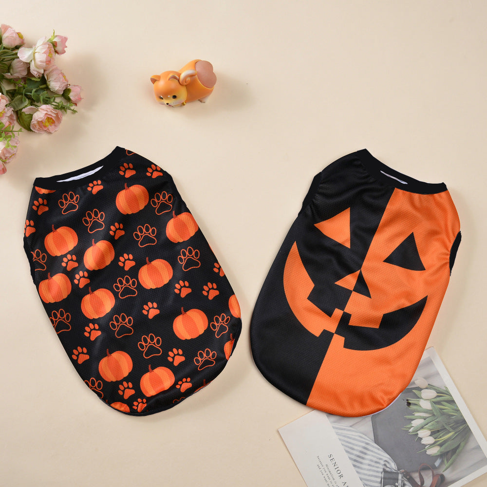 Halloween costumes for dogs featuring pumpkin and paw print designs in black and orange fabric.
