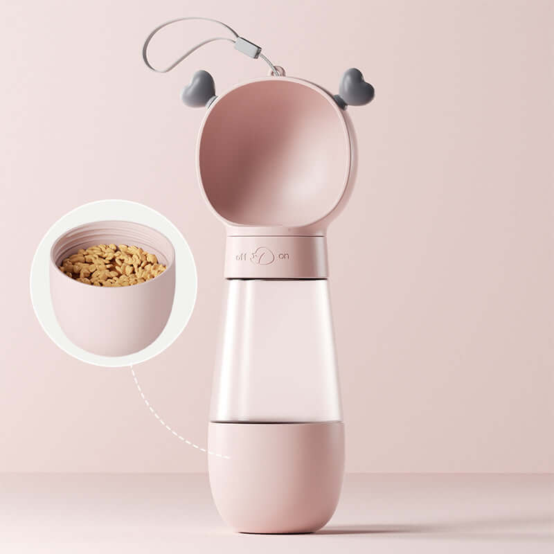 Gobelet d'eau portable pour chiens, pratique pour les promenades, en rose avec compartiment pour nourriture.