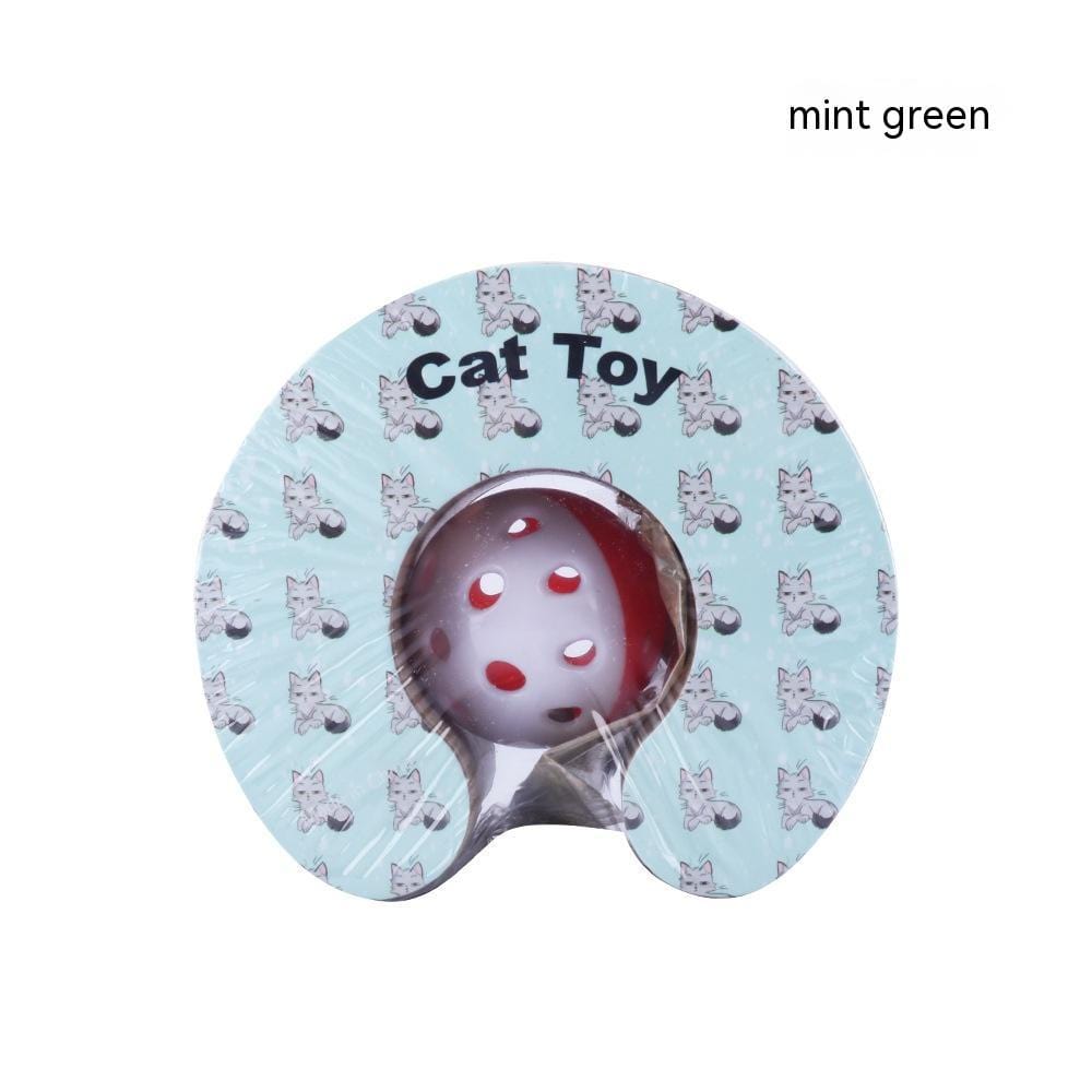 Jouet pour chat en vert menthe avec balle rouge perforée, conçu pour divertir votre félin.