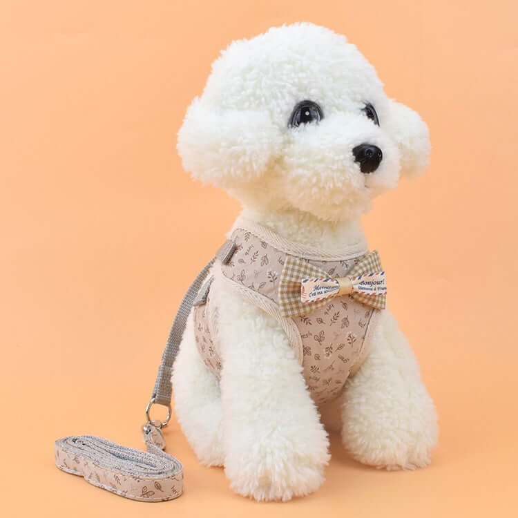 Harnais pour chien avec laisse, en tissu confortable, style élégant avec nœud papillon.
