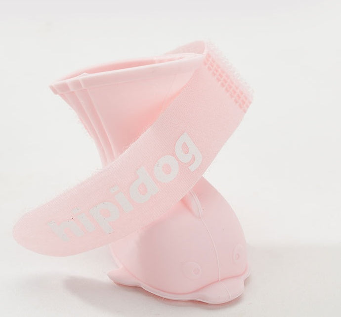Jouet interactif pour chien en forme de dauphin, en silicone doux et rose, idéal pour le jeu et la stimulation mentale.