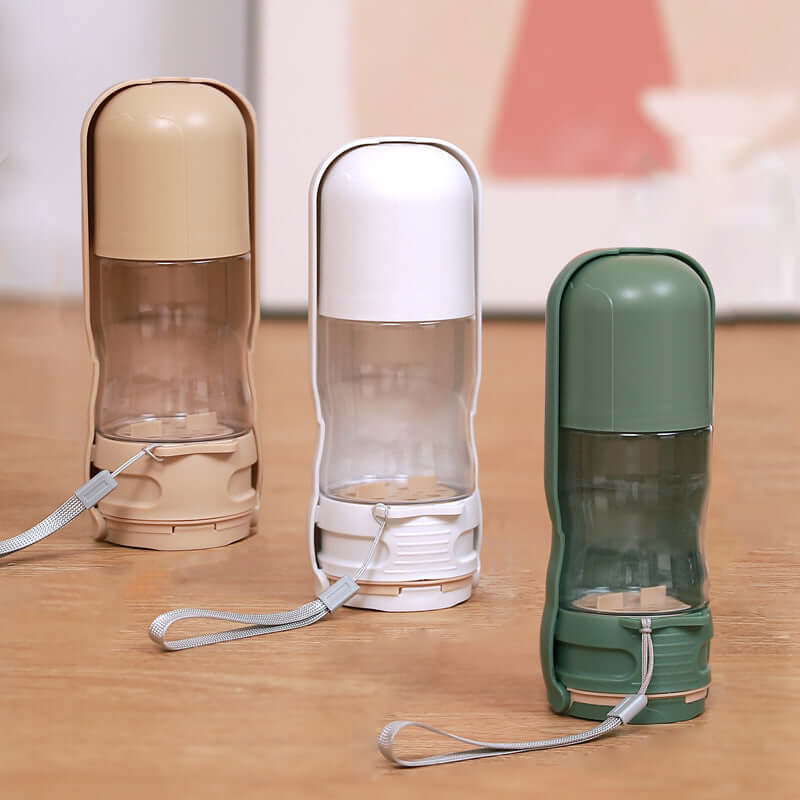 Bol portable pliable pour chiens en trois couleurs : beige, blanc et vert, idéal pour l'hydratation en extérieur.