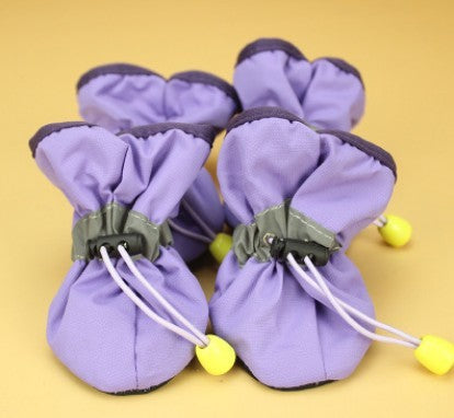 Chaussures antidérapantes douces pour chiens en tissu violet, parfaites pour le confort et la protection.