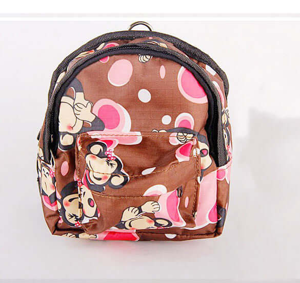 Mignon petit sac à dos en tissu avec motif de singes et bulles roses.