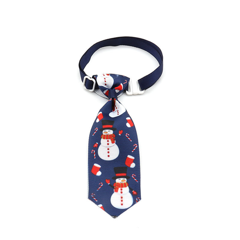 Nœud papillon de Noël pour animaux de compagnie avec motifs de bonhommes de neige et cannes en sucre.