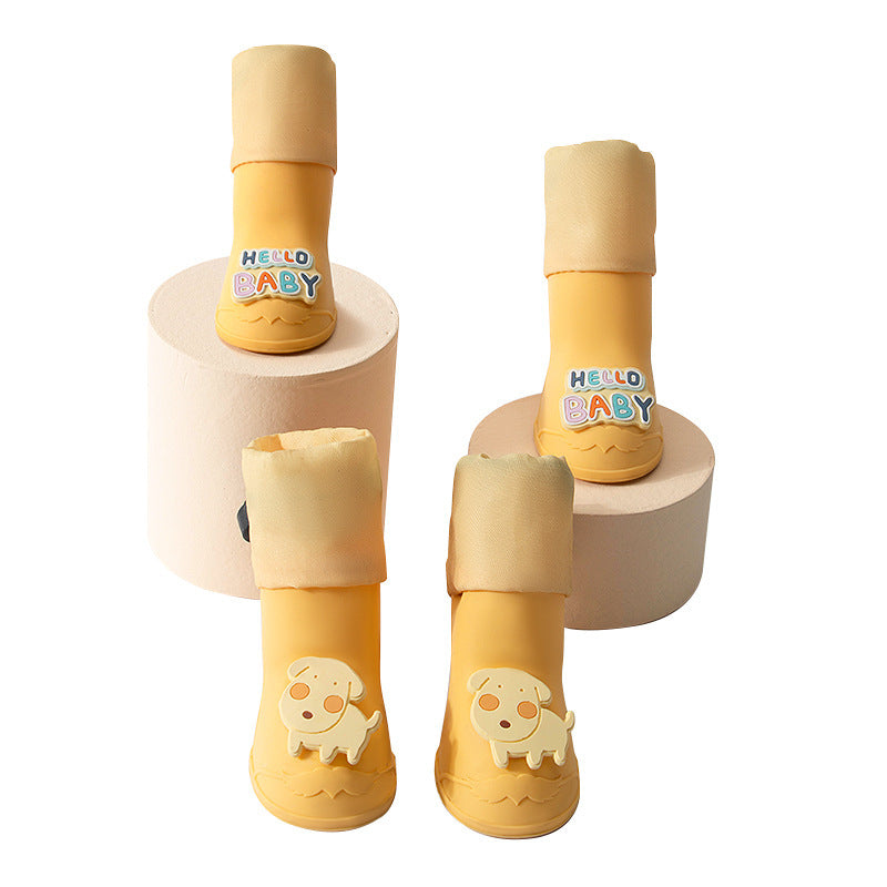 Bottes pour chiens jaunes imperméables avec design cartoon et étiquettes amusantes, idéales pour le confort de votre animal.