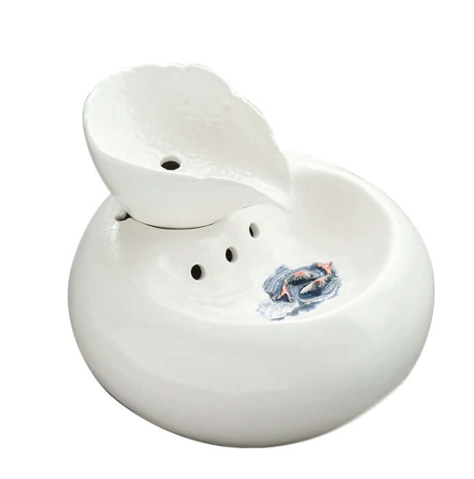 Distributeur d'eau automatique pour chat en porcelaine blanc et rose, élégant et pratique pour l'hydratation des animaux.